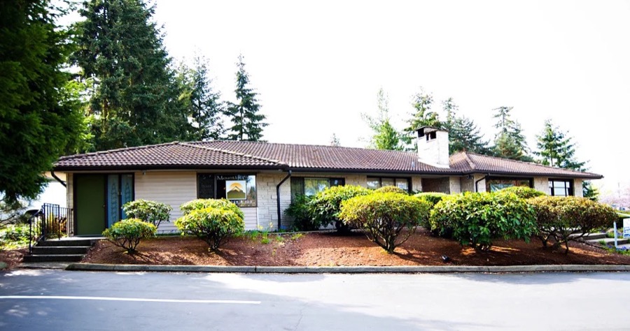 Mountain Sun Massage & Skin Care exterior in Kirkland with trees and landscaping